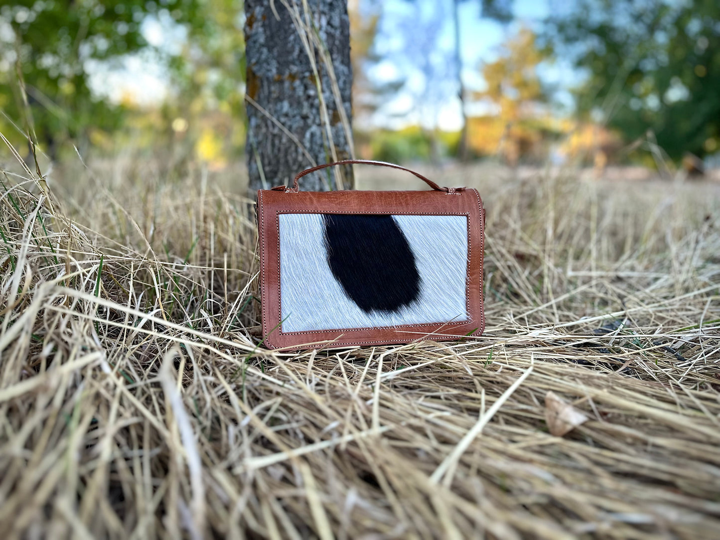 CARTERA DE MANO COW PRINT DE CUERO CON PELO NATURAL
